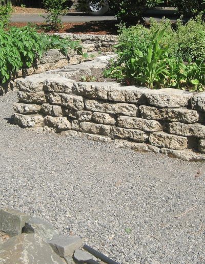 A Greenhaven Landscapes design customer's Vancouver WA stone raised beds and gravel walkways