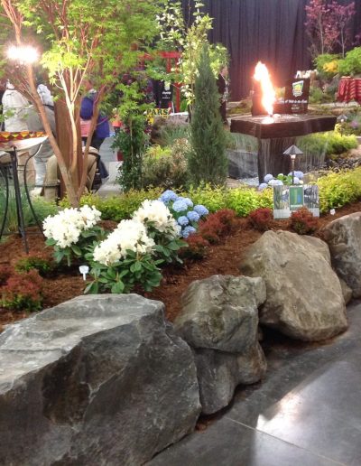 A Greenhaven Landscapes design customer's Vancouver WA stone raised bed at an evening event