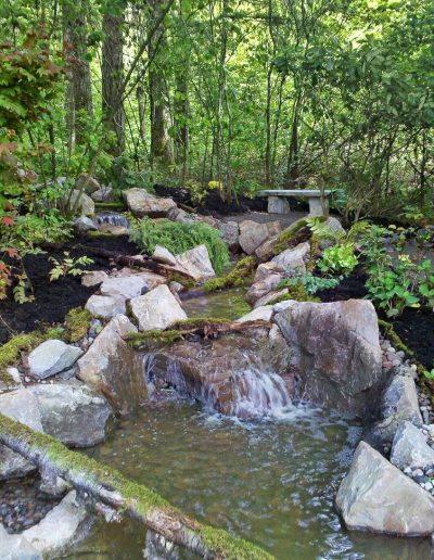 A Greenhaven Landscapes design customer's Vancouver WA large stone waterfall and pond