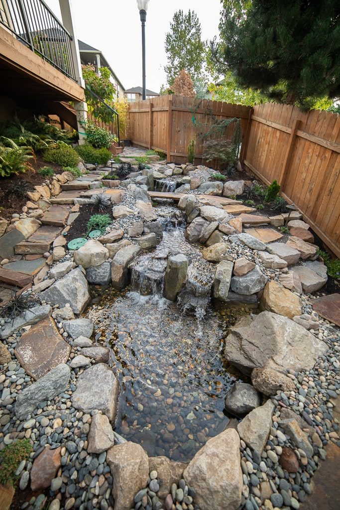 A Greenhaven Landscapes-designed Vancouver WA back yard waterfall water features using large stones