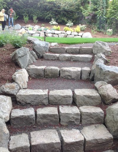 A Greenhaven Landscapes customer's Vancouver WA backyard stone stairs and walls
