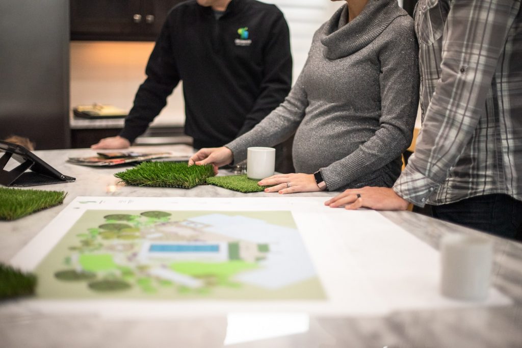Greenhaven landscape designers discuss design with customers