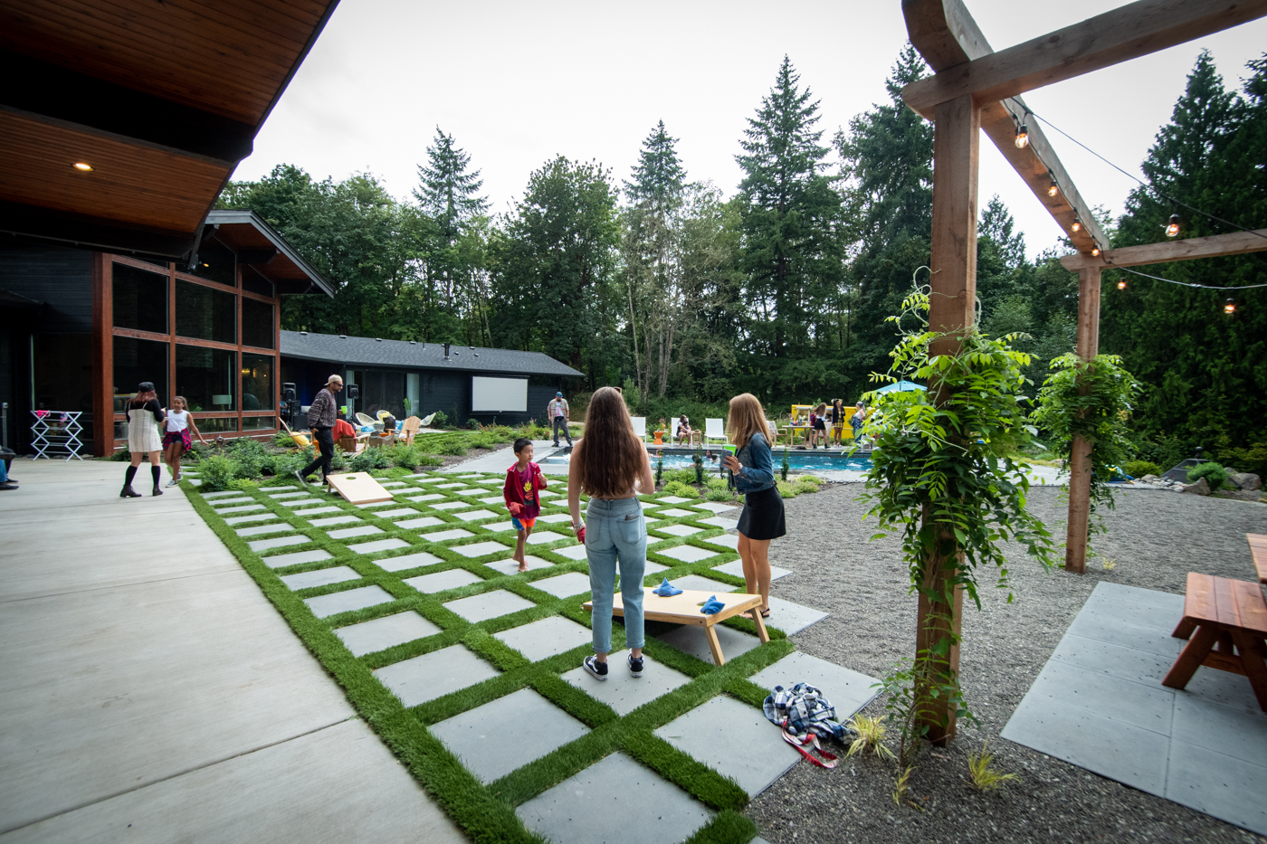 VividReveal_6405 Family plays outdoor games on their patio