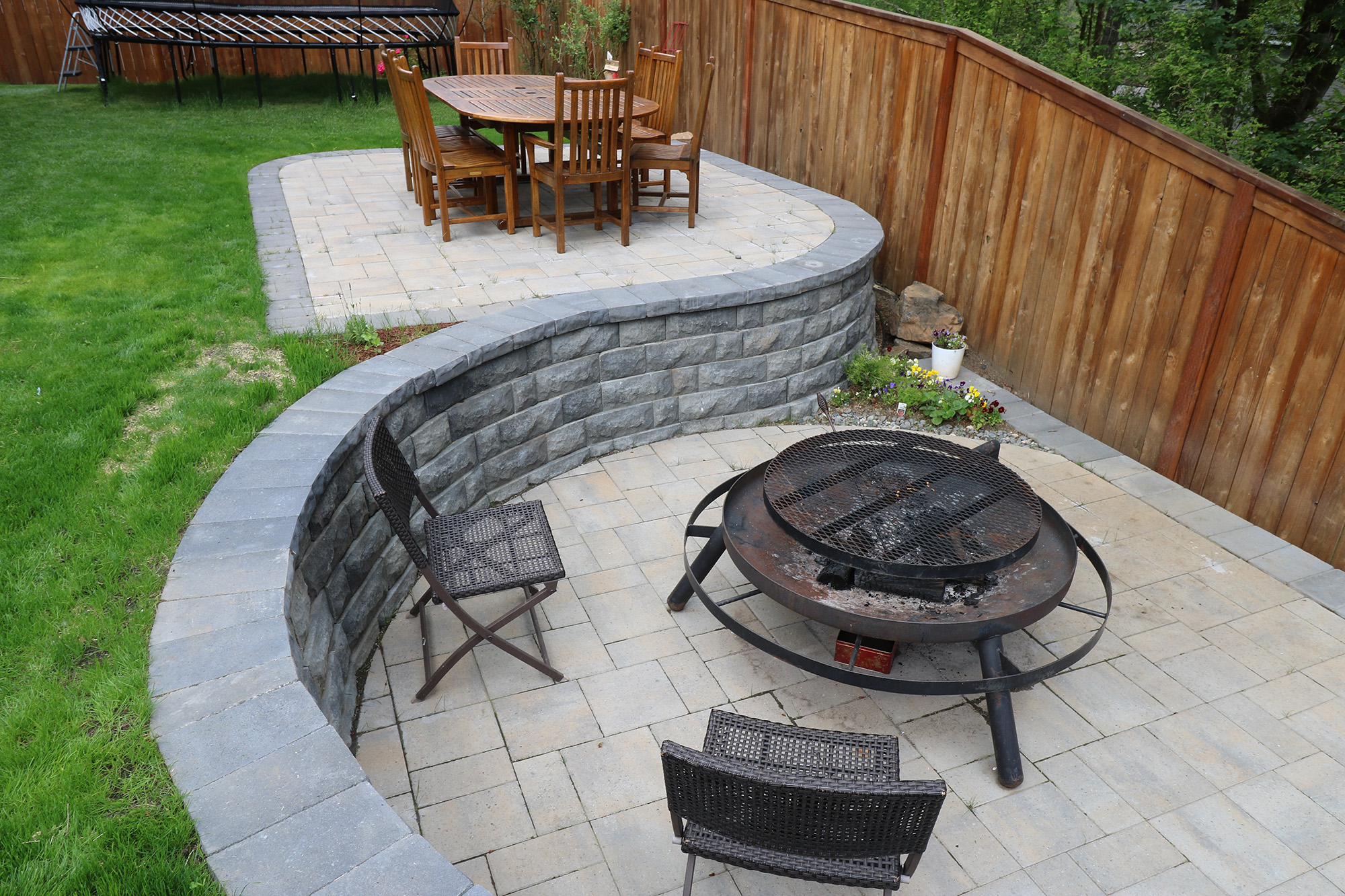 two-level patio with retaining wall by Greenhaven Landscapes
