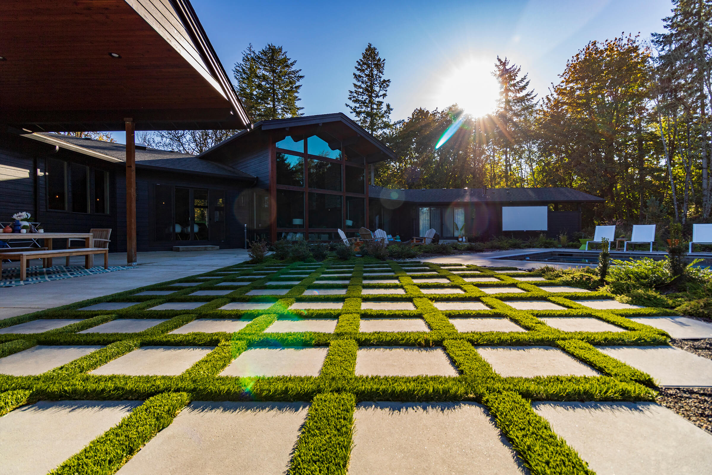 Grassy patio stone patio with artificial turf between the stones