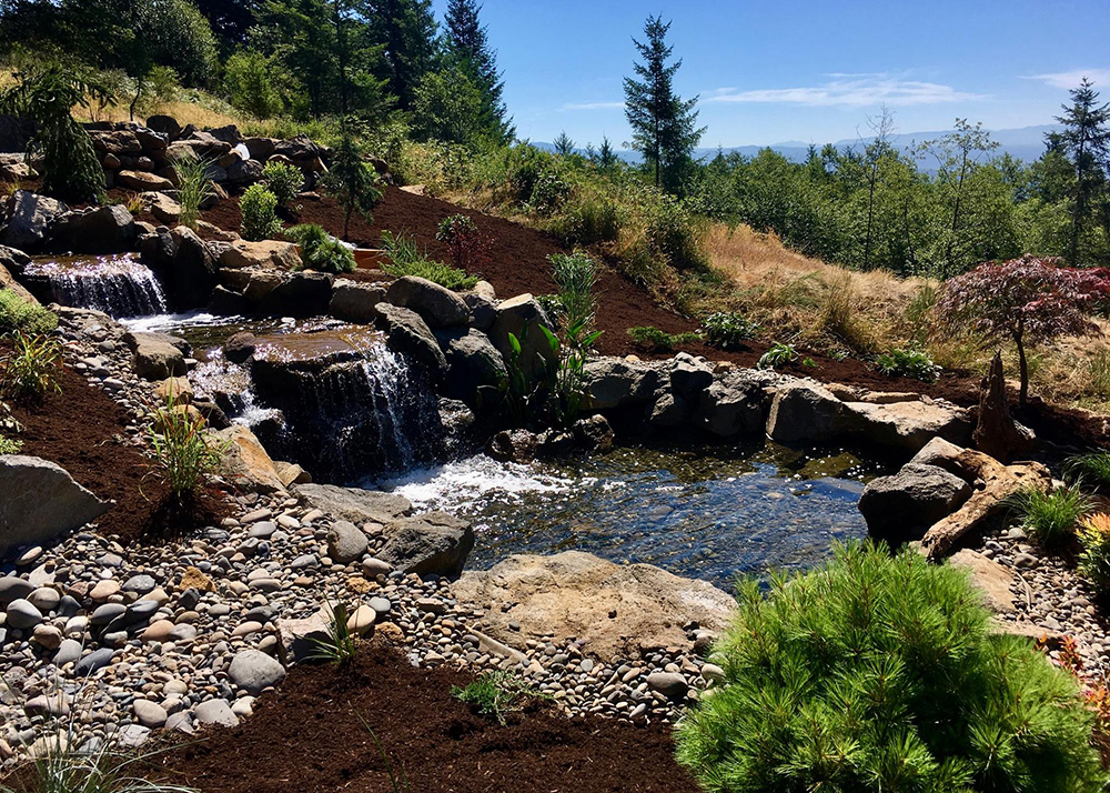 a backyard water feature from Greenhaven Landscapes