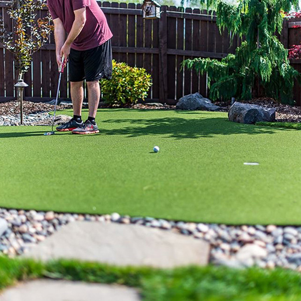 putting on artificial turf from Greenhaven Landscapes