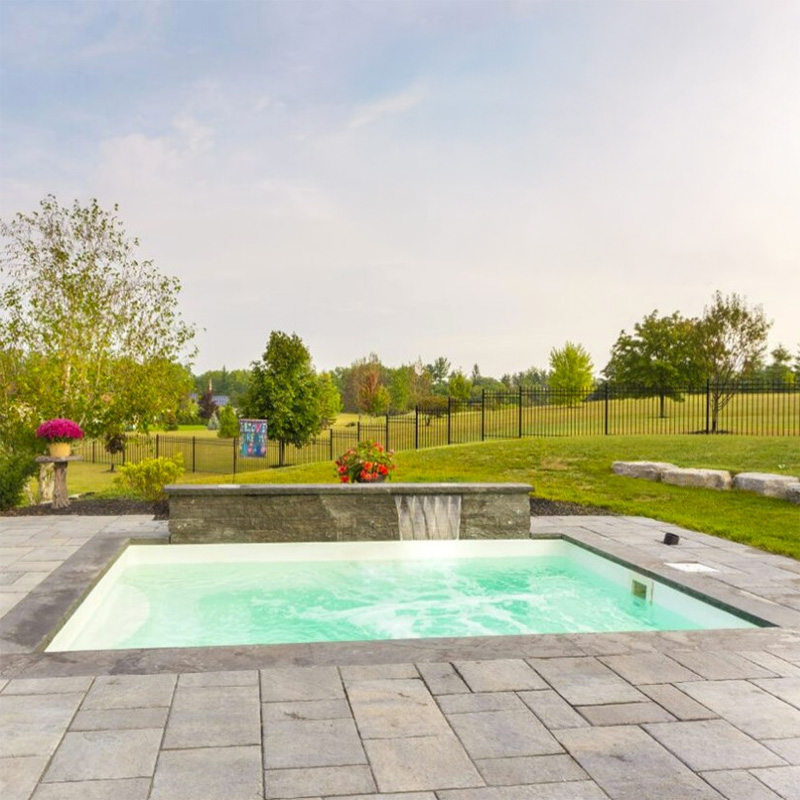 Immerspa Solitude inground spa in an open yard landscape