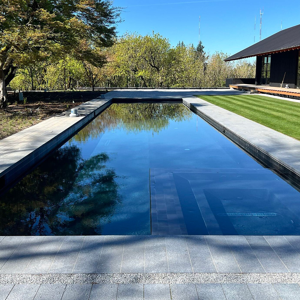 a home's custom pool from Greenhaven Outdoor Living