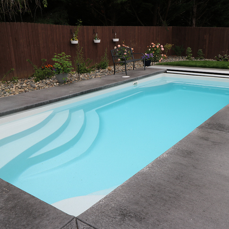 a home backyard fiberglass pool from Greenhaven Outdoor Living
